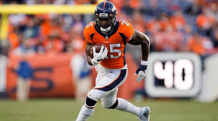 Dec 12, 2021; Denver, Colorado, USA; Denver Broncos running back Melvin Gordon III (25) runs the ball in the third quarter against the Detroit Lions at Empower Field at Mile High.